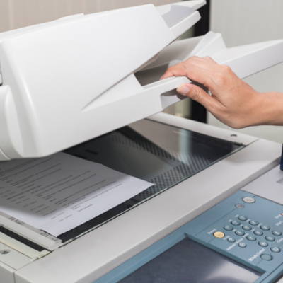 woman opening a photocopier woman opening a photocopier